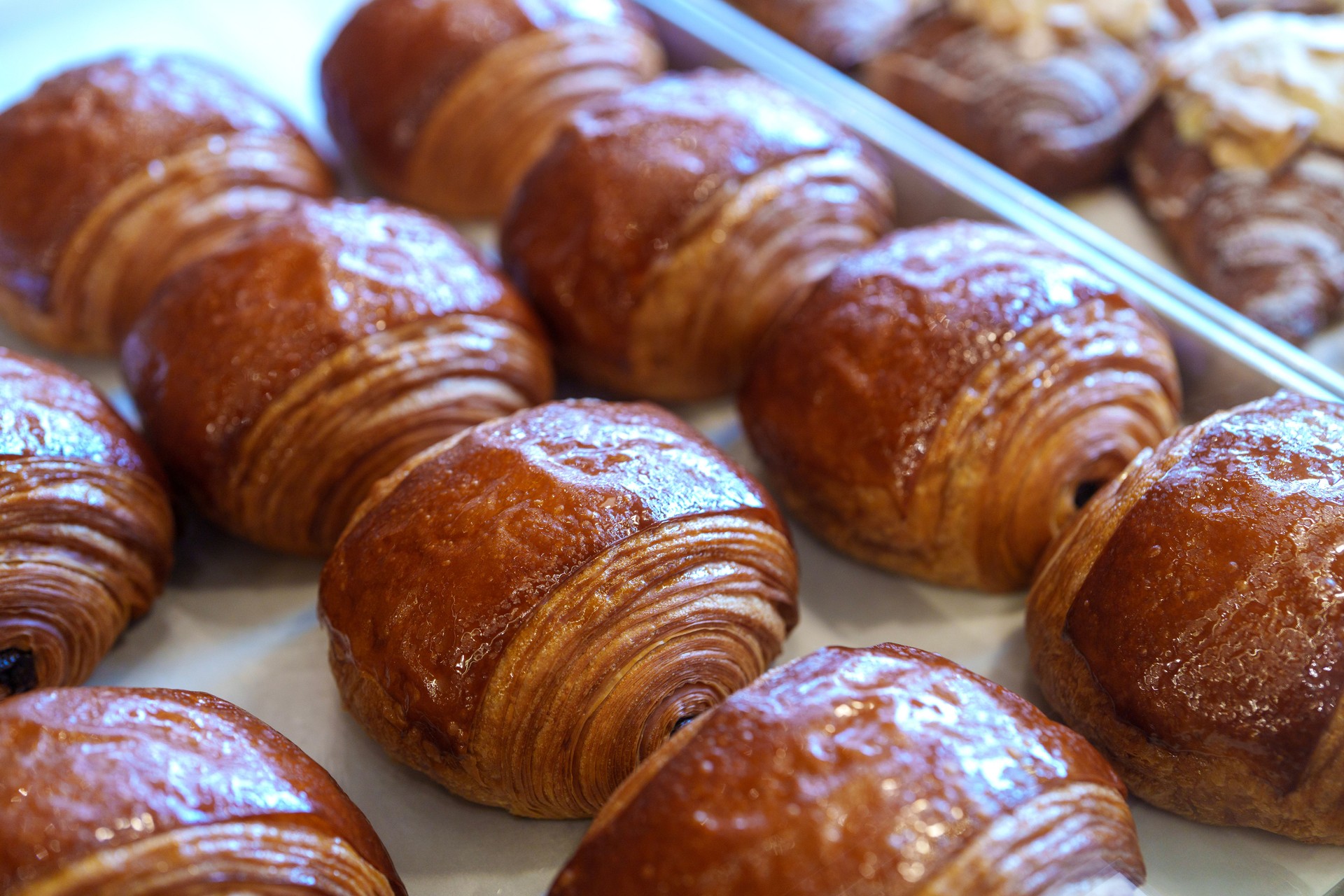 Freshly baked pain au chocolat on bakery tray